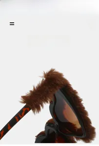 Detailed macro view of heart sunglasses with brown faux fur texture and tortoiseshell frames