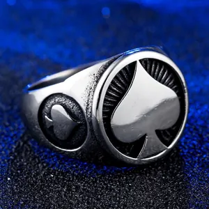 Vintage punk spade ring in silver and black titanium steel for men on a dark base