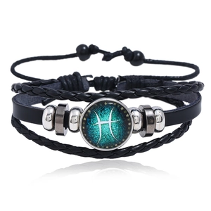 Detailed view of multilayer woven leather Pisces constellation bracelet with blue charm