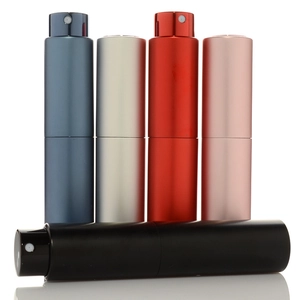 Detailed view of 10ml twist-up perfume atomizers in blue silver red pink and black