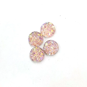 Close-up of 8mm pink round resin rhinestones with sparkling starry texture for DIY jewelry