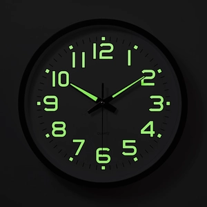 12 inch luminous wall clock with black dial and glowing green Arabic numerals