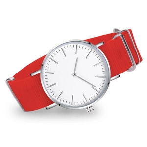 Detail of white quartz watch face with silver markers and red nylon woven strap