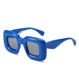 Y2K blue puffy oversized square sunglasses with thick wrap frames and dark lenses