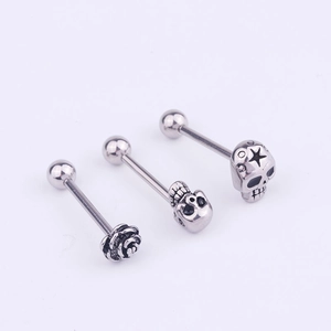 Three-piece stainless steel piercing set with silver skull and rose flower designs