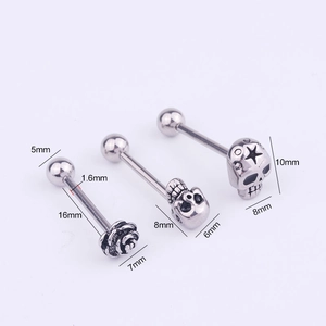 Macro detail of stainless steel tongue rings with skull and rose shapes and sizing metrics