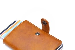 Detail view of brown PU leather wallet featuring metal clasp and card slots with fine stitching