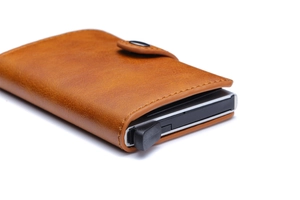 Brown leather pop-up wallet with vintage texture and aluminum anti-theft card slot