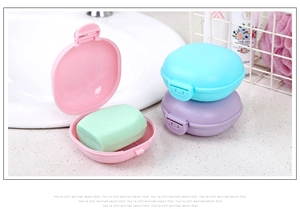 Three colorful round waterproof soap boxes with lids for travel storage in pink and blue