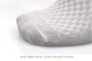 Detailed macro view of gray bamboo fiber sock toe with reinforced hidden stitching