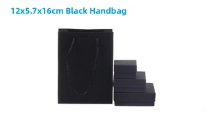 Detail of matte black paper gift bag with handles and matching jewelry boxes 12x5.7x16cm