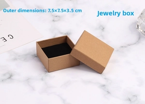 Detail of kraft paper jewelry box measuring 7.5x7.5x3.5cm with black foam insert