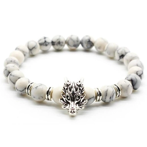 Macro detail of men's white marble stone bracelet with a silver dragon head charm