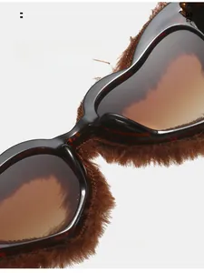 Detail of comfortable nose pads on heart-shaped sunglasses with brown faux fur trim