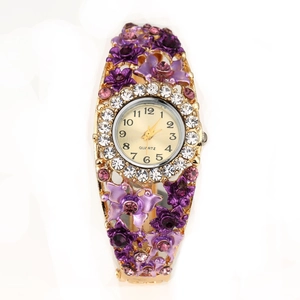 Detailed view of women flower bangle watch with purple enamel and pavé rhinestones