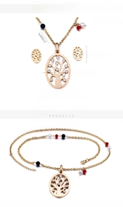Detail of Tree of Life jewelry set with 18K gold plating and sparkling white crystals