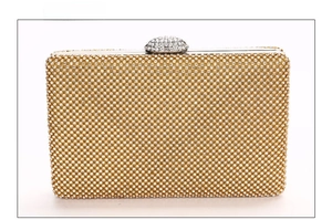 Detailed back view of the golden evening clutch bag featuring shimmering white rhinestones