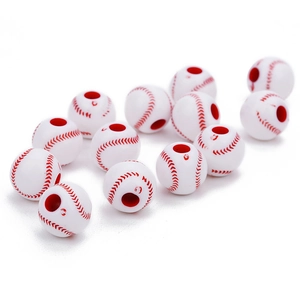 Macro detail of 12mm white acrylic baseball beads with red stitch patterns for DIY crafts
