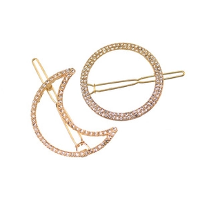 Detail of gold moon and circle hair clips with shimmering crystal rhinestones set