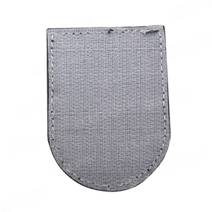 Close-up of tactical sniper embroidery patch with grey woven fabric and white stitching