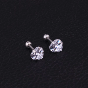 Macro view of heart-shaped zircon stud earrings with screw ball back in silver finish