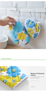 Detail view of the floral cotton heat resistant oven mitt and pot holder set fabric texture