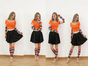 Detail of colorful rainbow striped knit arm and leg warmers with thumb holes for cosplay