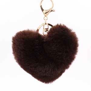 Close-up of brown heart plush keychain with gold metal lobster clasp and fluffy texture