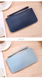 Detail showing deep blue and light blue long wallets with gold zippers and wristlets