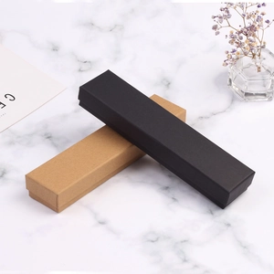 Rectangle kraft and black jewelry gift boxes for necklaces on a marble background