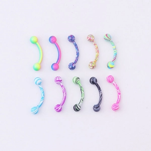 Close-up of ten colorful curved barbell piercing studs with diverse patterns and finishes