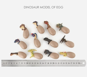 Detailed top view of 12 assorted dinosaur egg models with a 30cm ruler for size reference