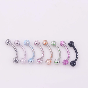 Detail showing eight curved eyebrow rings with colorful splatter paint design on steel balls