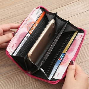 Detail of rose red long wallet showing multiple card slots and phone compartment