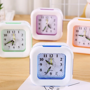 Minimalist square quartz alarm clock collection with colorful frames in a home setting