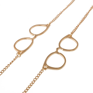 Golden metal eyewear chain featuring decorative spectacle pendants and non-slip design