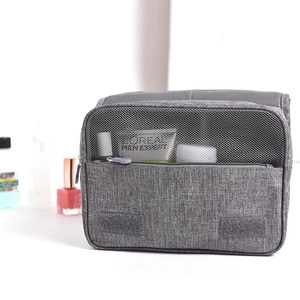 Grey hanging toiletry bag with mesh pocket and hook for travel cosmetic storage