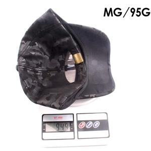 Detailed view of camouflage baseball cap weighing approximately 95g on a digital scale