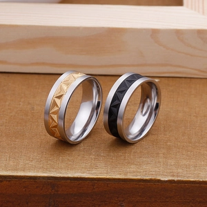 Titanium steel ring with embossed geometric triangle pattern in gold and silver finish