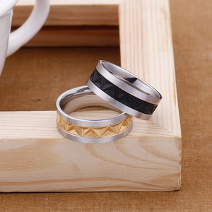 Industrial titanium steel rings with geometric pyramid patterns in gold and silver finish