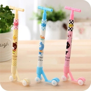 Three colorful scooter-shaped ballpoint pens in yellow, blue and pink for students