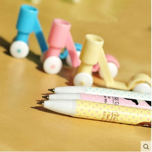 Creative scooter-shaped ballpoint pens in yellow, pink and blue with polka dot patterns