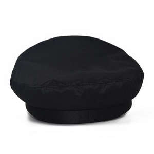 Classic black PU leather baker boy hat with structured visor and minimalist octagonal design