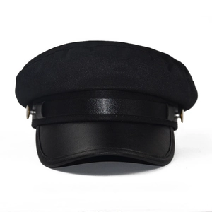 Classic black baker boy hat with cotton crown, faux leather brim and metallic button details