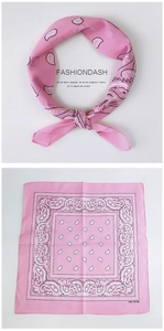 Detail of pink paisley cotton scarf with 100% cotton label and retro street style pattern