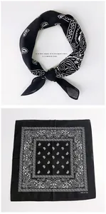 Detailed view of black paisley cotton bandana with classic white print and logo tag