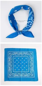 Flat and knotted view of a blue 100% cotton square scarf with white paisley patterns