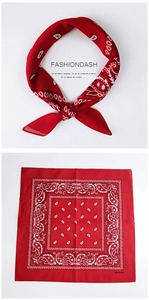 Macro view of 100% cotton red paisley bandana showing fabric texture and square pattern