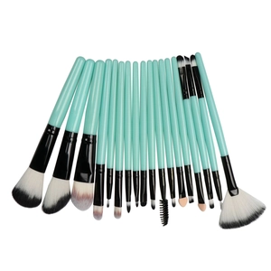 Detail of 18-piece mint green makeup brush set with various professional bristles and handles