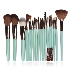 Detailed set of 16 makeup brushes with mint green handles and rose gold ferrules